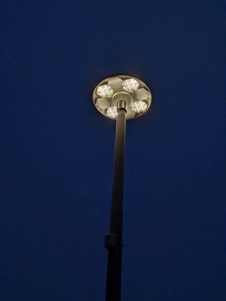 istock White metallic street light against a blue backdrop 1927677788