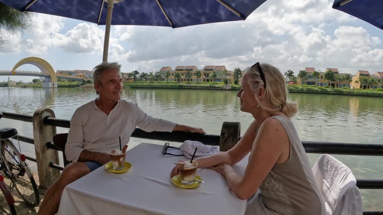 Mature couple enjoy cafe