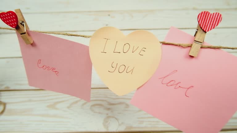 Valentine's day concept. The word love on a wooden background. Love letters