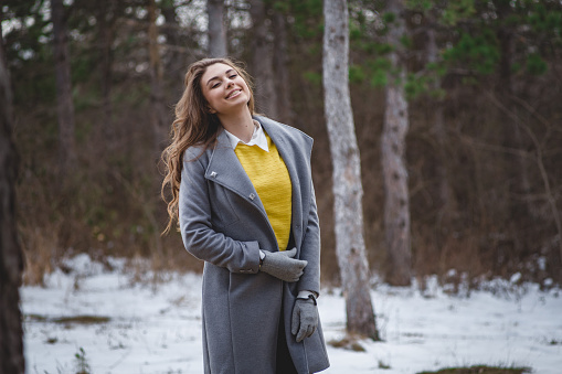 Portrait of a confident woman outdoor in winter time