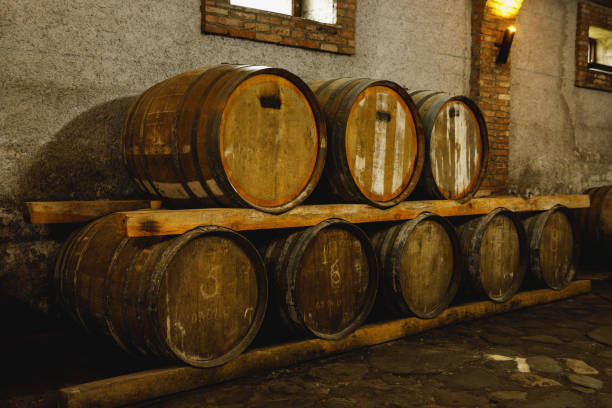 istock Old wine cellar with wooden oak barrels. 1927735148