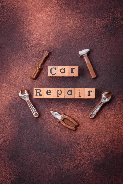istock Tools and inscriptions symbolizing repairs or a garage and its attributes on a plain background 1927750404