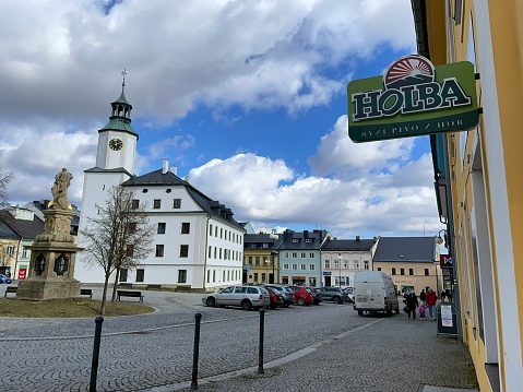 Rýmařov, Czech Republic - March 16, 2023: The main square and town hall. Holba beer advertisement