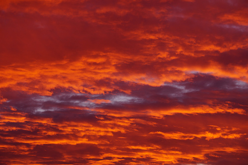 orange-crimson sunset sky in the clouds, red sky.