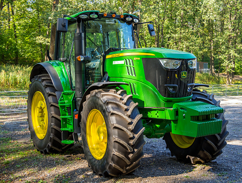 Voronezh, Russia - September 10, 2021: Modern agricultural tractor John Deere series 6155M