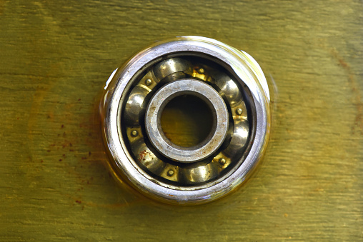 ball bearing in lubricant oil . old ball bearing in motor oil  .