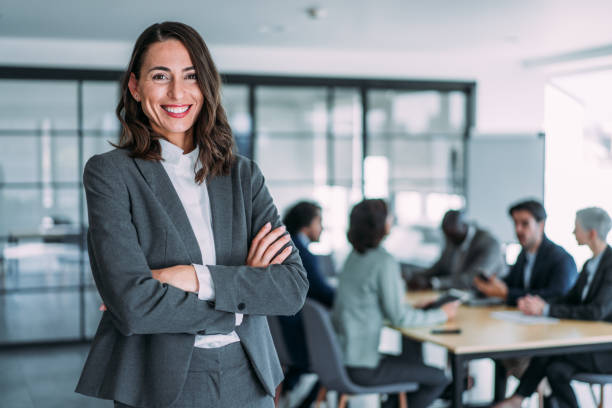 istock Confident businesswoman and her team. 1927881383