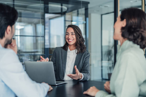 group of business persons talking in the office. - business meeting expressing positivity interview business foto e immagini stock