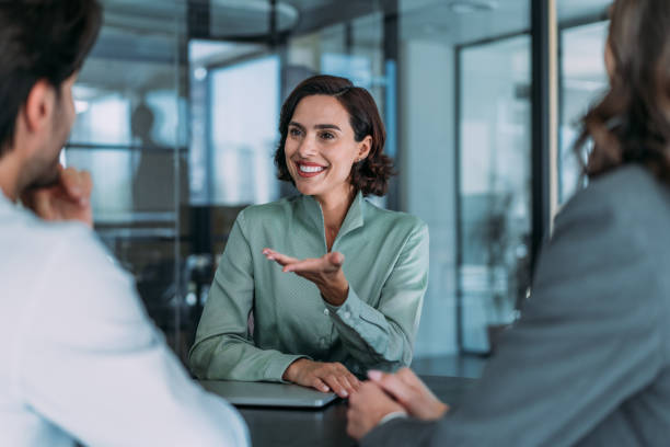 istock Group of business persons talking in the office. 1927881401