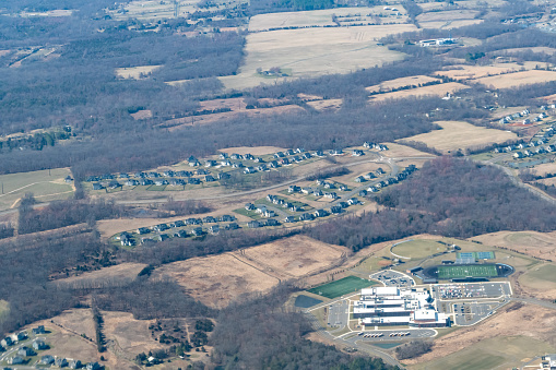 Aerial view of Aldie, Virginia featuring John Champe High School, South Fork Broad Run and housing developments in the Aldie Area of Northern Virginia