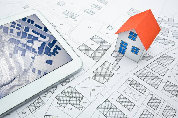 istock Buildings Permit concept with imaginary cadastral on digital tablet - building activity and construction industry concept with General Urban Plan and home model 1927923393