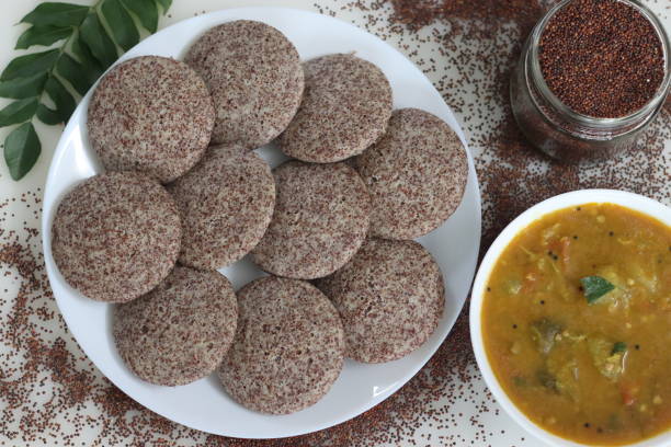 istock Ragi Idli served with sambhar. A nutritious South Indian staple made with fermented batter of unpolished finger millet and deskinned black gram 1927927533