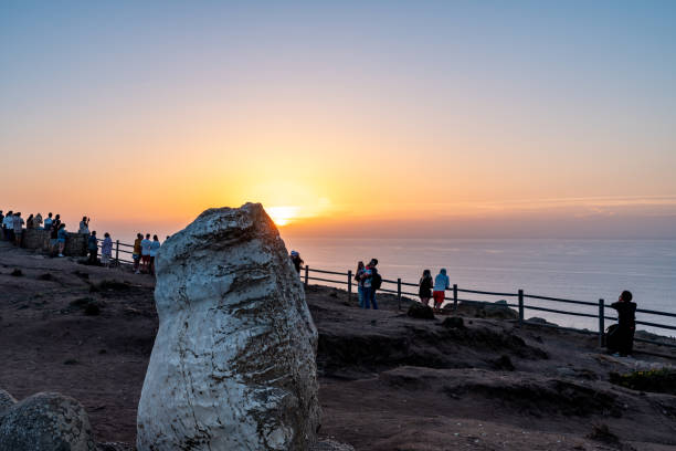 westernmost point of continental europe, cabo da roca at dusk, sintra, portugal - sintra sunset cross outdoors ストックフォトと画像