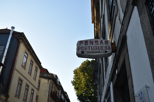 The old Pensão Portuguesa Residencial lettering, in Travessa Coronel Pacheco in Porto (Portugal), on the trendy neighborhood in Porto.