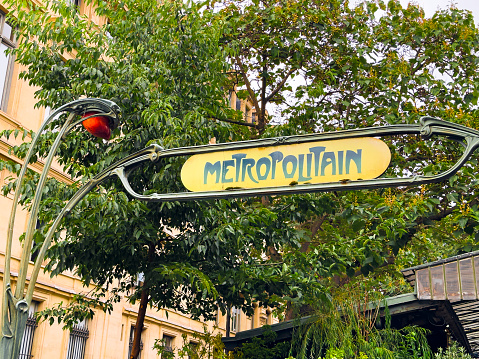 Paris, France — September 19, 2023: Entrance sign to the Metro subway station. Beautiful Art Nouveau style.