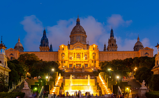 Barcelona, Spain - May 2019: National Palace (Palau Nacional) and magic fountain show on Montjuic hill in Barcelona