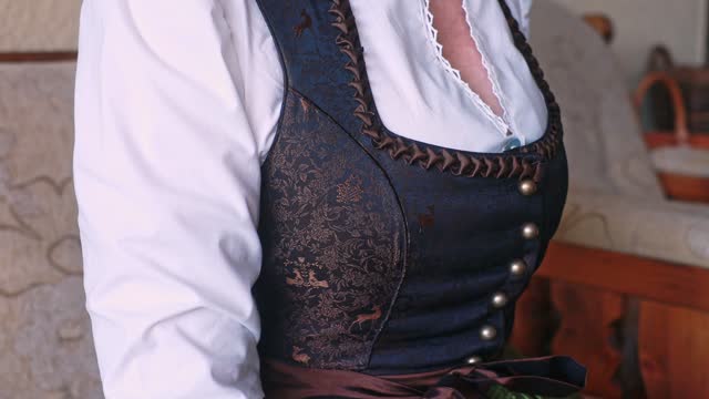 Close-up profile of the tight-fitting bodice of a traditional Austrian women's dirndl costume