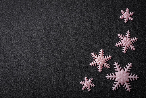 Beautiful winter snowflakes on a plain background with copy space. Winter background for your design