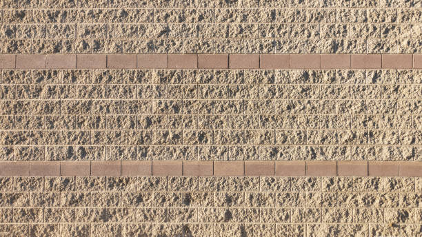 istock Wide angle view of a textured cinder block wall. 1928103223