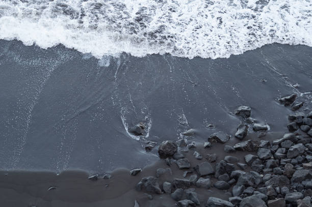 istock beach with black volcanic sand on  Tenerife 1928111619