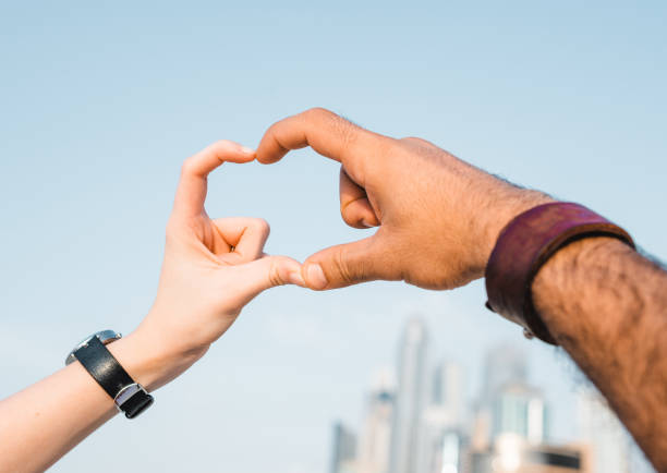 together showing an heart shape on the sky