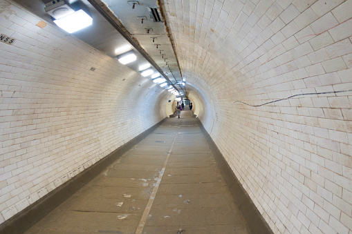 The Greenwich Foot Tunnel crosses beneath the River Thames in East London, linking Greenwich (Royal Borough of Greenwich) on the south bank with Millwall (London Borough of Tower Hamlets) on the north.