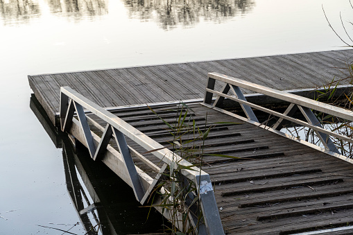 Solitary wooden pier on the banks of the Duero River as it passes through Tordesillas - Spain