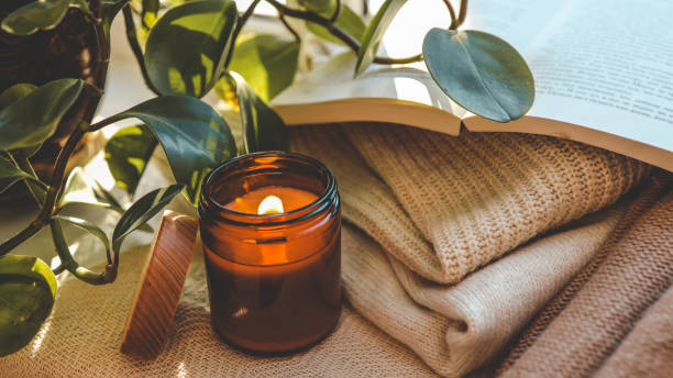 istock Burning candle in a cozy home interior 1928344462