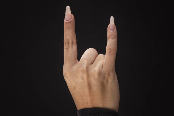female hands with big nails using fingers to make various signs