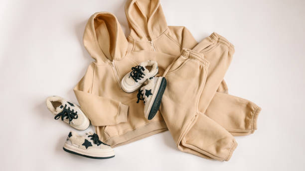 istock Children's tracksuits on a white background, advertising 1928368431