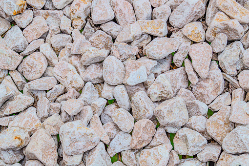 Close-up of large and small gray stones by the sea in Turkey.