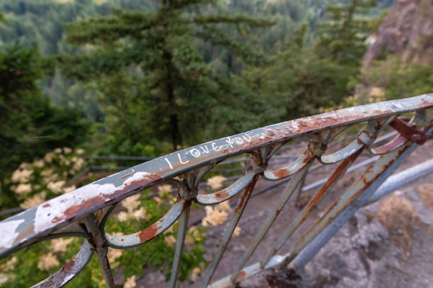 Words written on railing of a cliff trail in Oregon