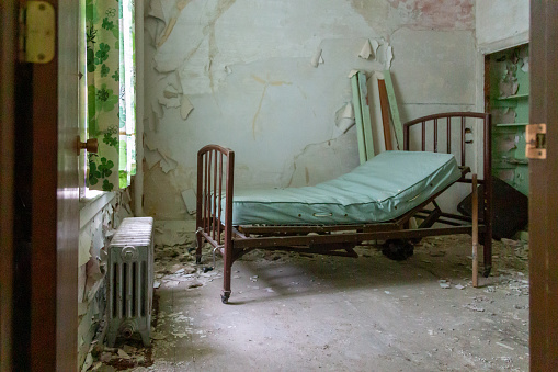 An old patient room in an abandoned hospital