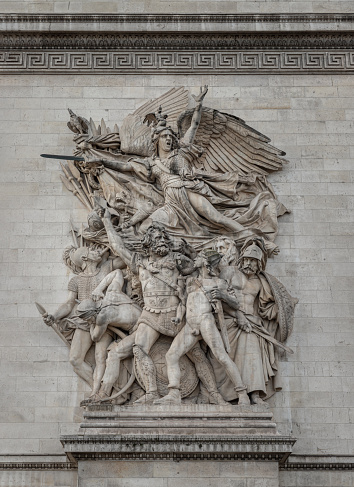 France, Paris - Jan 03, 2024 - Detail of a sculptural group is a monumental stone high relief. Departure of the Volunteers of 1792 which is and is the most famous statue commonly known as La Marseillaise on the north pillar of the Arc de Triomphe, Place Charles de Gaulle, Selective focus.