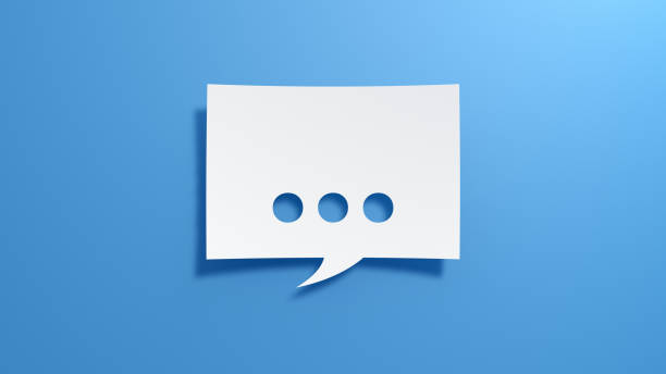 istock Three Dots. Speech Bubble. Minimalist abstract design with white cut out paper on blue background. 1928545026