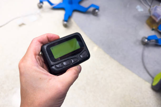 istock vintage pager on a busy desk, symbolizing hectic work life and essential communication in a hospital setting 1928565825