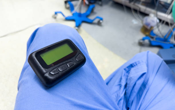 istock vintage pager on a busy desk, symbolizing hectic work life and essential communication in a hospital setting 1928565828