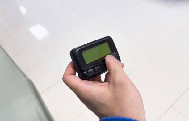 istock vintage pager on a busy desk, symbolizing hectic work life and essential communication in a hospital setting 1928565833