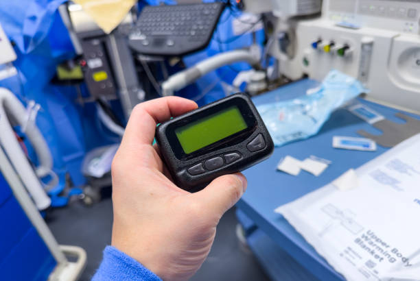 istock vintage pager on a busy desk, symbolizing hectic work life and essential communication in a hospital setting 1928565834