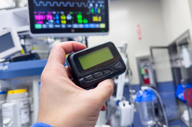 istock vintage pager on a busy desk, symbolizing hectic work life and essential communication in a hospital setting 1928566343