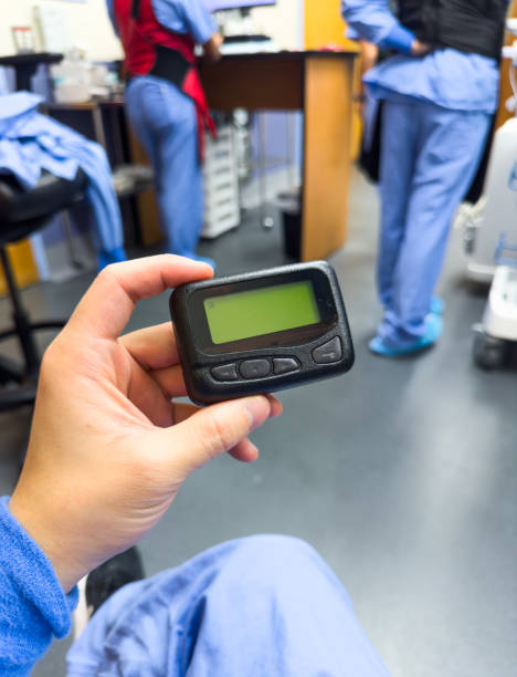 istock vintage pager on a busy desk, symbolizing hectic work life and essential communication in a hospital setting 1928566345