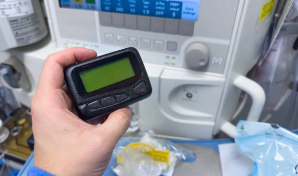 vintage pager on a busy desk, symbolizing hectic work life and essential communication in a hospital setting