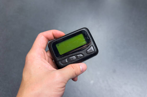 istock vintage pager on a busy desk, symbolizing hectic work life and essential communication in a hospital setting 1928566468