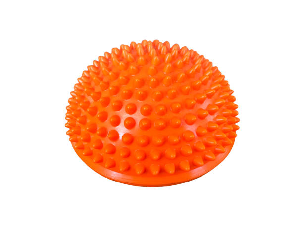istock Orange rubber hemisphere with many spikes for physiotherapy 1928666028