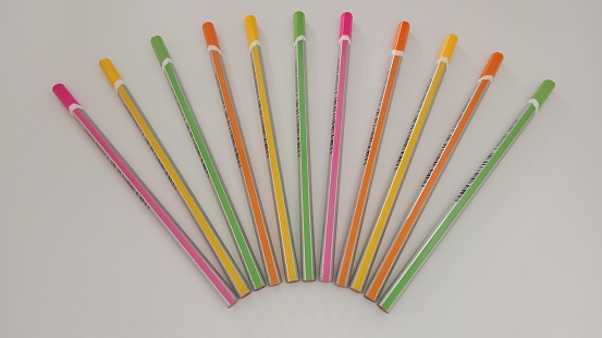 Assorted colored pencils on a white background