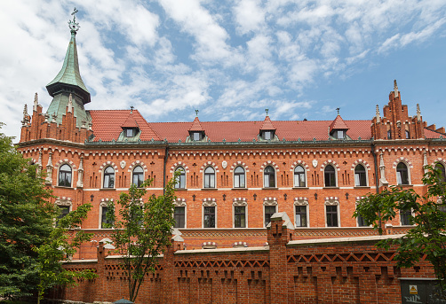 The brick facade of the Higher Theological Seminary of the Archdiocese of Krakow, Poland.