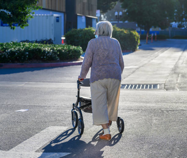 istock A senior woman walking outdoors with her mobility walker. 1928805167