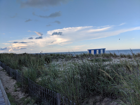 View of ocean and umbrella stand, Rehoboth Beach, Delaware