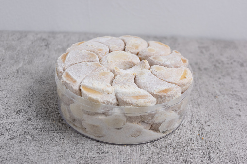 Kue Putri Salju are cute crescent shaped vanilla cookies with a crumbly, and covered in confectioners sugar. Indonesian dry cakes, for the celebration of Eid al-Fitr