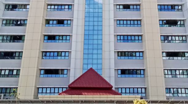 This building with lots of windows is right in the middle of a big city